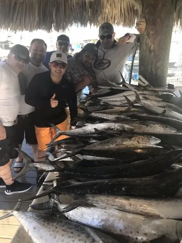 Happy group with a big mixed catch at the marina