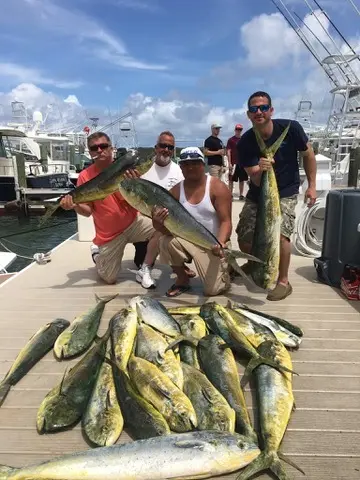 Group at the dock with a big catch of mahi-mahi